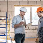 two-builders-collaborate-to-build-a-new-home-KSLM7VG.jpg